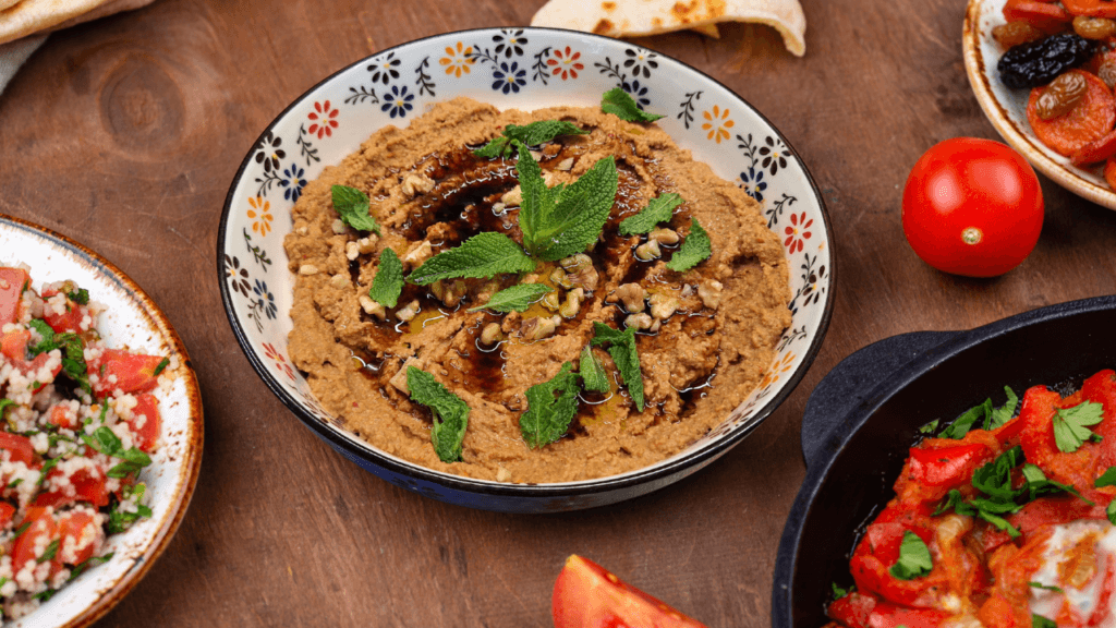 Muhammara red pepper and walnut spread served with flatbread.